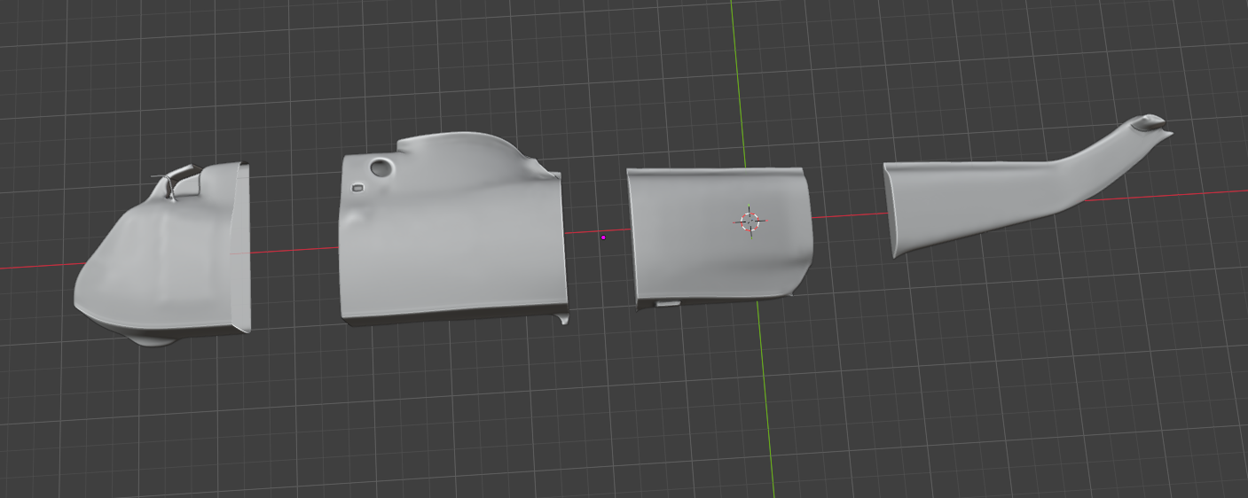 Separated helicopter hull sections prepared for foam carving.